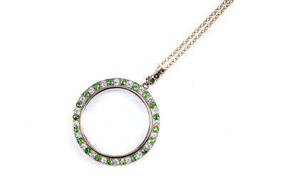 Lot 978 - An Edwardian demantoid garnet and diamond picture pendant