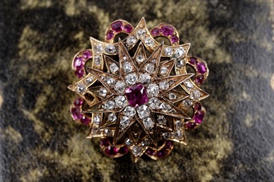Lot 979 - A Victorian ruby and diamond star pattern brooch