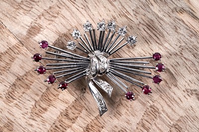 Lot 831 - A mid-20th Century ruby and diamond star-burst brooch