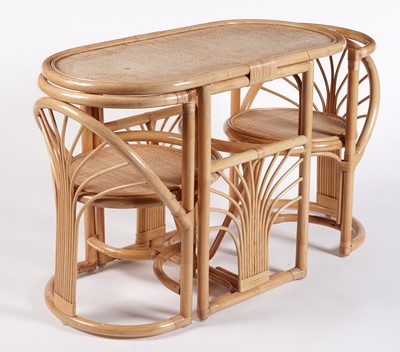Lot 17 - A 20th Century bamboo and rattan table and tuck under chairs