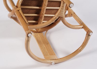 Lot 17 - A 20th Century bamboo and rattan table and tuck under chairs