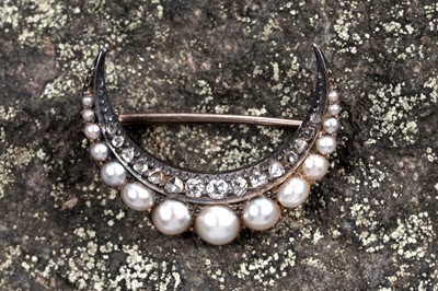 Lot 846 - A Victorian pearl and diamond crescent brooch