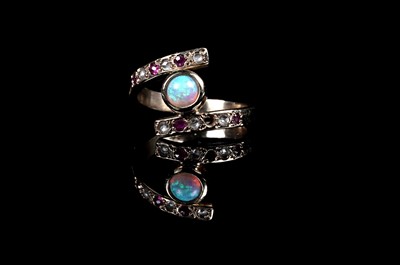 Lot 241 - An opal, ruby, and diamond ring