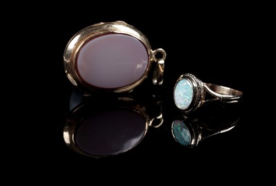Lot 242 - A modern opal ring; and a carnelian locket