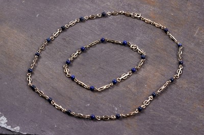 Lot 992 - A 9ct yellow gold and lapis lazuli necklace and bracelet