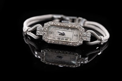 Lot 994 - An Art Deco diamond set platinum cased cocktail watch