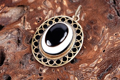 Lot 246 - A bull's-eye agate and cloisonne enamelled pendant