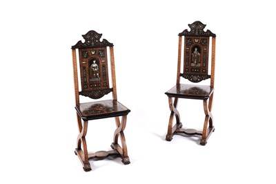 Lot 608 - A pair of Italian 19th Century Renaissance style inlaid walnut hall chairs