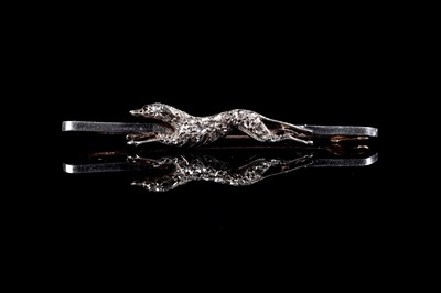Lot 251 - An early 20th Century ruby and diamond greyhound pattern brooch