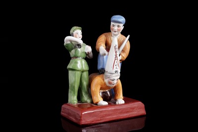 Lot 313 - A Chinese porcelain Cultural Revolution propaganda group with the humiliated land owner Lui Wencai