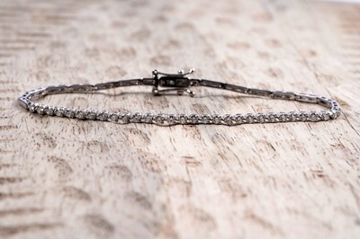 Lot 958 - A diamond line bracelet