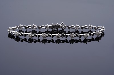 Lot 959 - A diamond and 18ct white gold bracelet