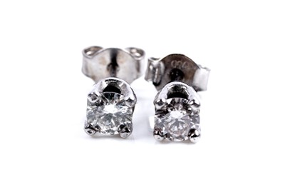 Lot 962 - A pair of diamond stud earrings