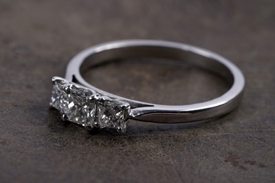 Lot 970 - A three stone princess-cut diamond ring