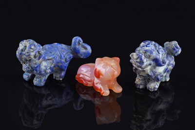 Lot 325 - Two lapis figures of Buddhist lions; and an agate cat