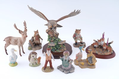 Lot 309 - A collection of various ceramic and cast figures