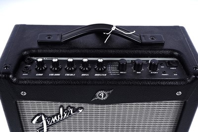 Lot 75 - A Cort KX300 electric guitar; and a Fender Mustang I V2 amp