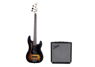 Lot 79 - A Squier Precision bass; and a Fender Rumble amplifier