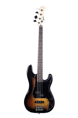 Lot 79 - A Squier Precision bass; and a Fender Rumble amplifier