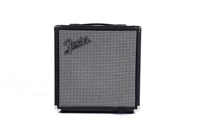 Lot 79 - A Squier Precision bass; and a Fender Rumble amplifier