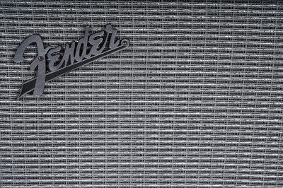 Lot 79 - A Squier Precision bass; and a Fender Rumble amplifier