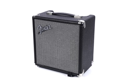 Lot 79 - A Squier Precision bass; and a Fender Rumble amplifier