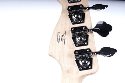 Lot 79 - A Squier Precision bass; and a Fender Rumble amplifier
