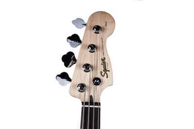 Lot 79 - A Squier Precision bass; and a Fender Rumble amplifier