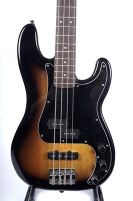 Lot 79 - A Squier Precision bass; and a Fender Rumble amplifier