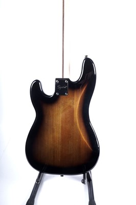 Lot 79 - A Squier Precision bass; and a Fender Rumble amplifier