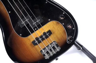 Lot 79 - A Squier Precision bass; and a Fender Rumble amplifier