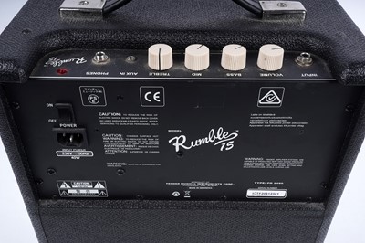 Lot 79 - A Squier Precision bass; and a Fender Rumble amplifier