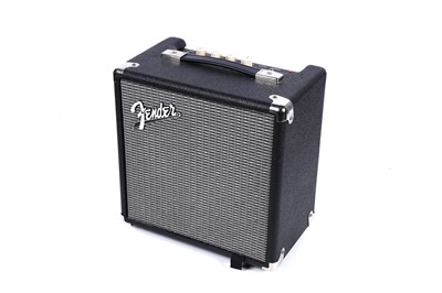 Lot 79 - A Squier Precision bass; and a Fender Rumble amplifier