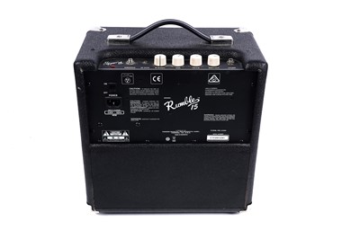 Lot 79 - A Squier Precision bass; and a Fender Rumble amplifier