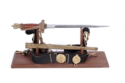 Lot 1196 - A German Second World War Kriegsmarine dress dagger with hangers and belt