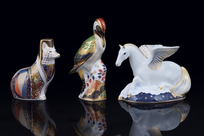 Lot 327 - Three boxed Royal Crown Derby paperweights