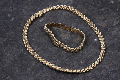 Lot 311 - A modern 18ct gold necklace and bracelet set