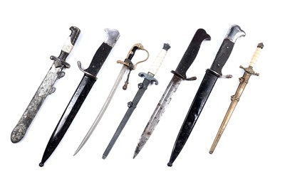 Lot 1199 - A selection of German miniature knives and swords