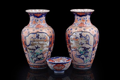 Lot 244 - A pair of early 20th Century Japanese Imari pattern vases; and another