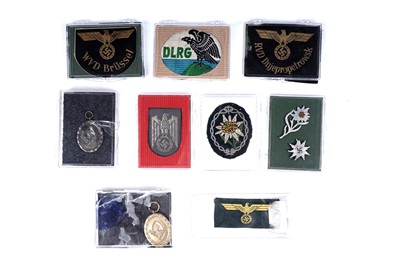 Lot 868 - A selection of German Second World War cloth and other badges