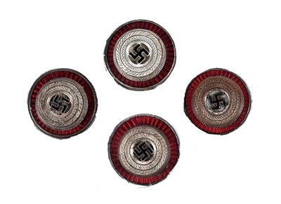 Lot 565 - Four NSDAP cap roundels