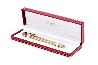 Lot 461 - A Must de Cartier gold-plated ballpoint pen