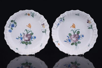 Lot 457 - A pair of French faience plates