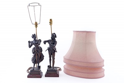 Lot 197 - A pair of patinated spelter figural table lamps