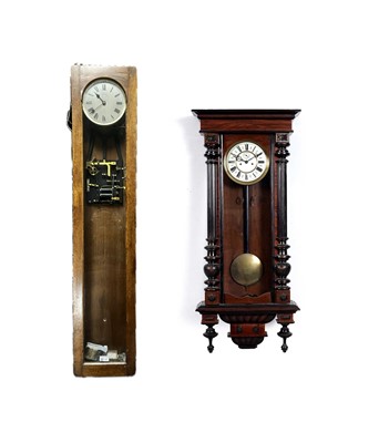 Lot 129 - A Synchronome electric wall-mounted clock; and a Vienna wall clock