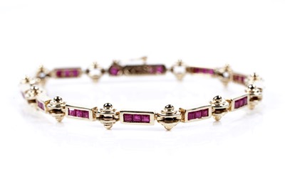 Lot 505 - A modern ruby bracelet on 14ct gold