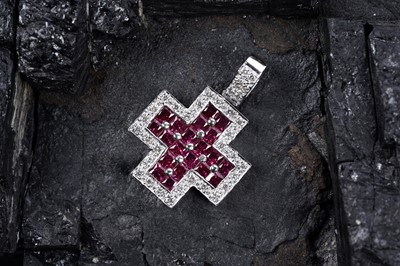 Lot 507 - A contemporary ruby and diamond cruciform pendant