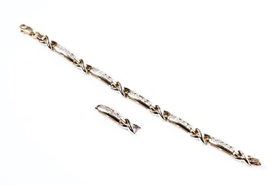 Lot 510 - An 18ct gold and cubic zirconia line bracelet