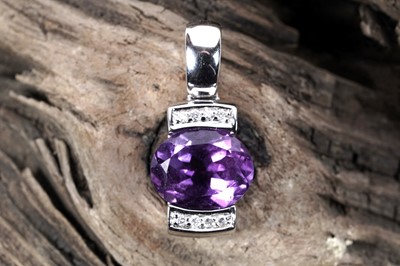 Lot 512 - A contemporary amethyst and diamond pendant