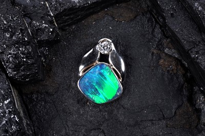 Lot 517 - A contemporary black opal and diamond pendant